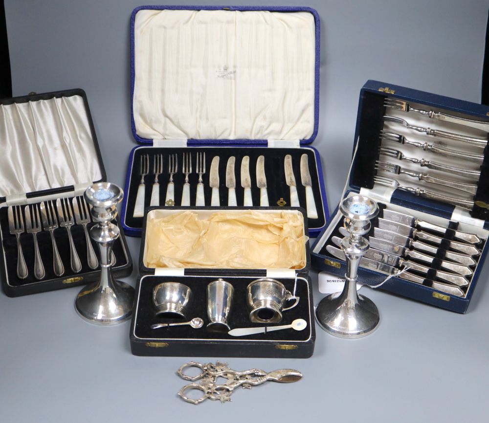 A pair of Continental silver grape scissors, a cased set of six silver cake forks and sundry items